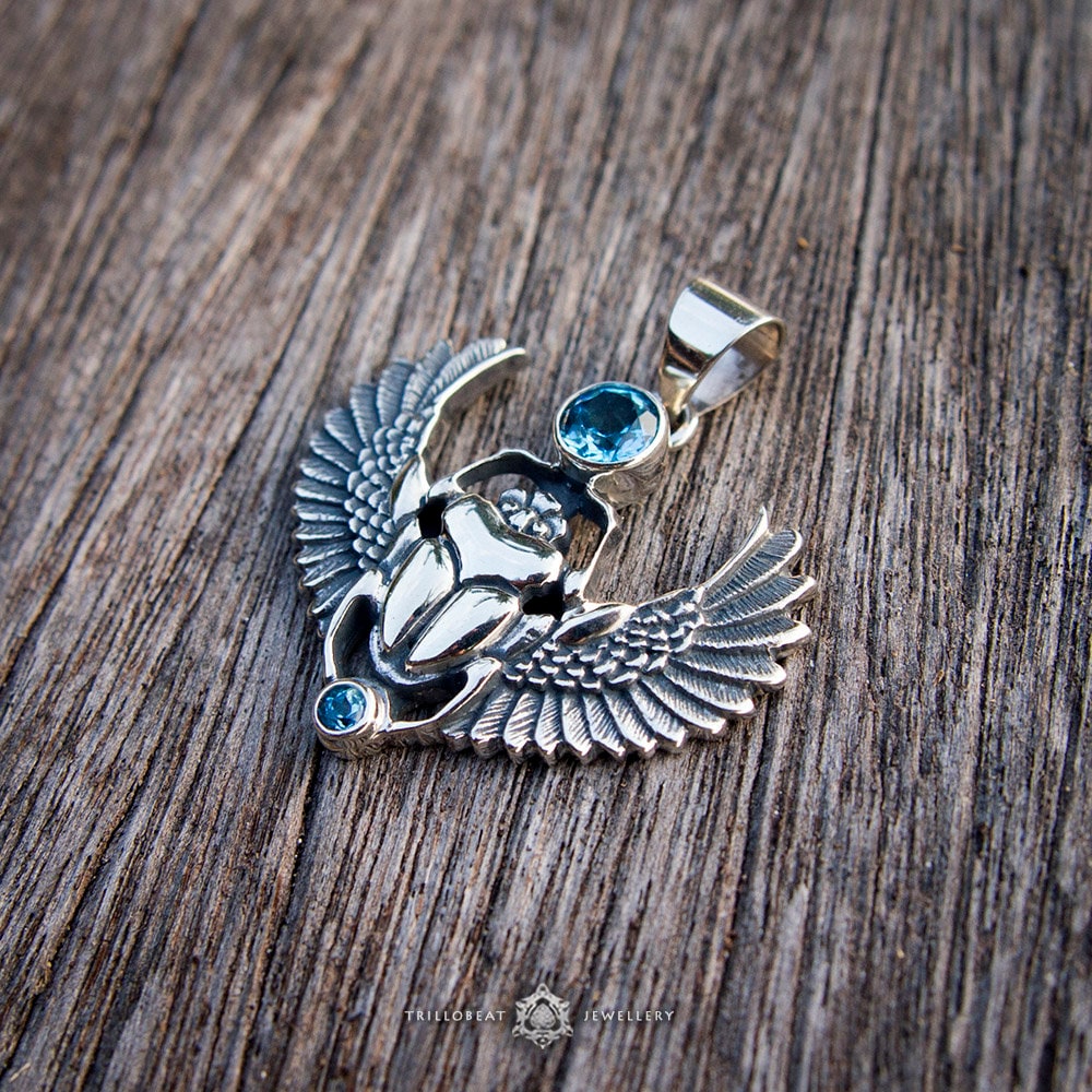 Silver scarab amulet photographed as spiritual jewelry