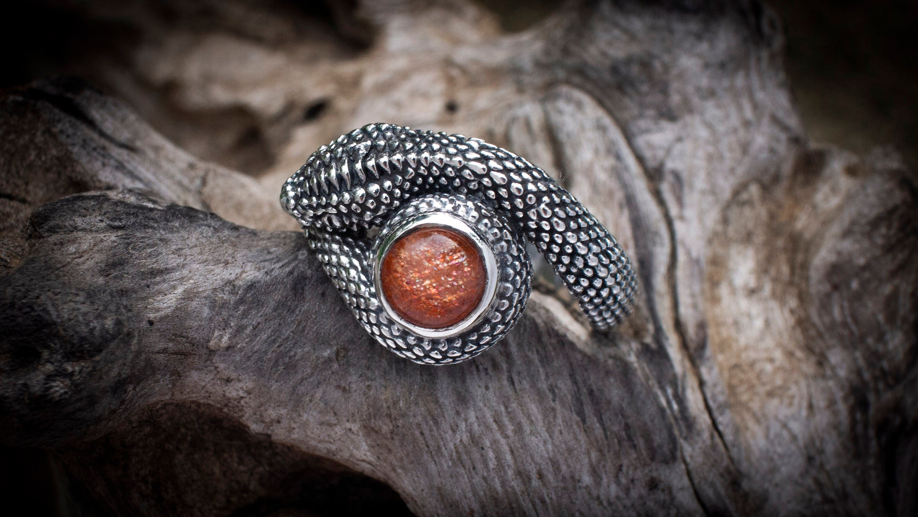 Silver snake ring with sculptural curved form