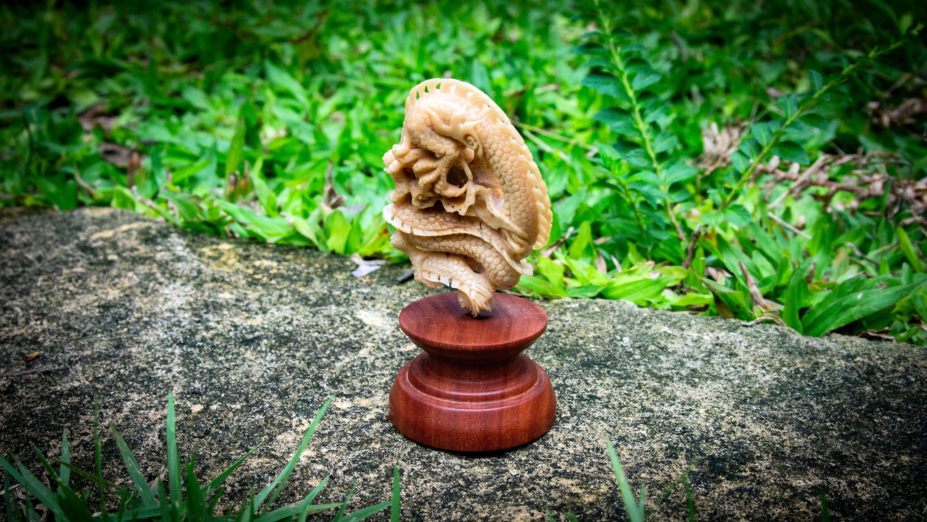Side view of handmade dragon statue with carved texture