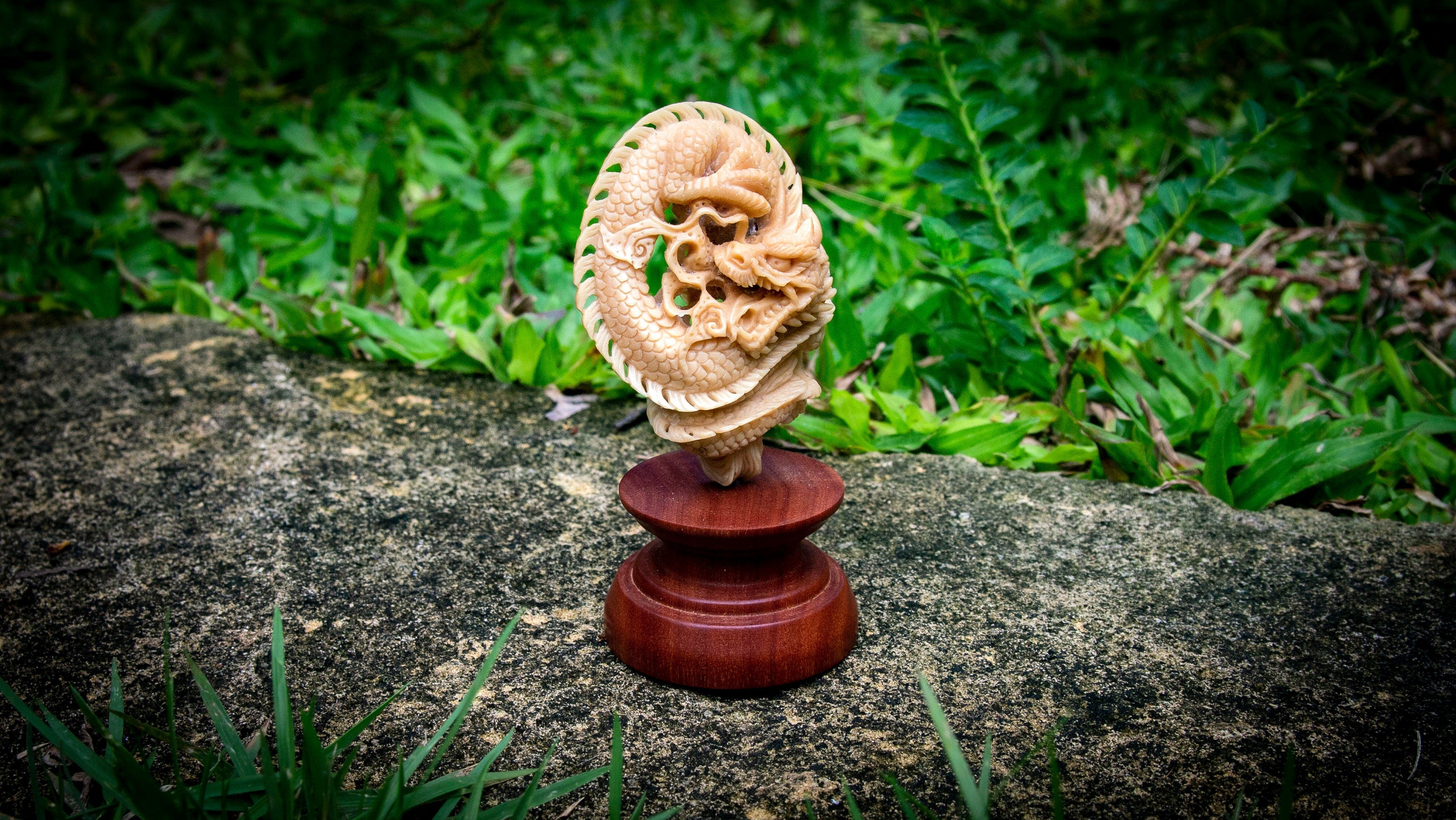 Close-up of dragon figurine showing head and scale details