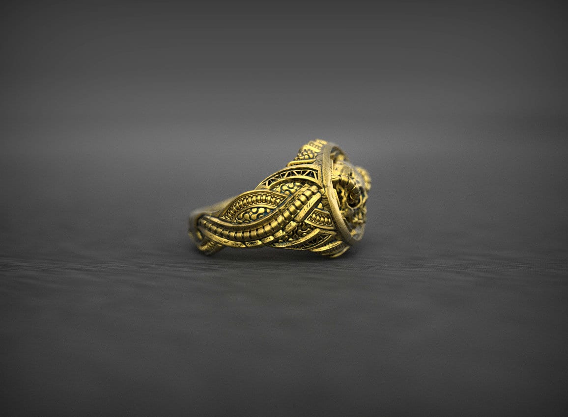 Handmade gold skull ring with dark sculptural details