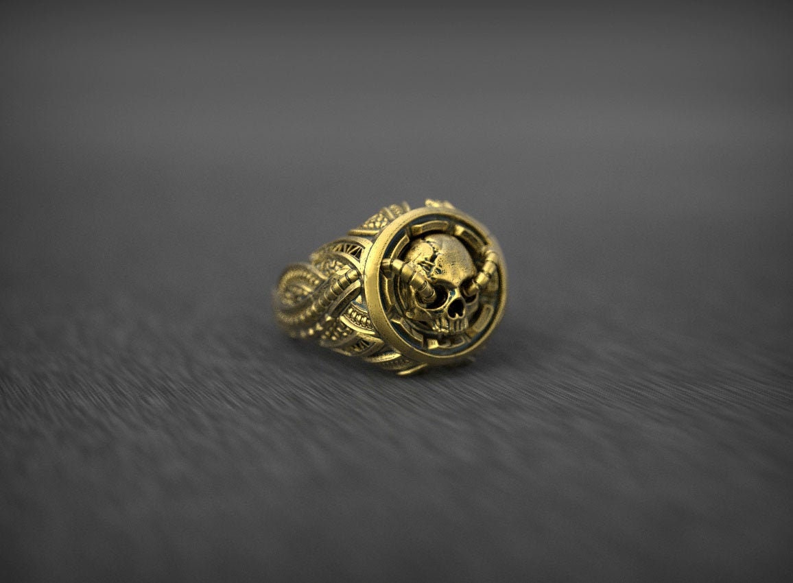 Side view of men’s gold skull statement ring