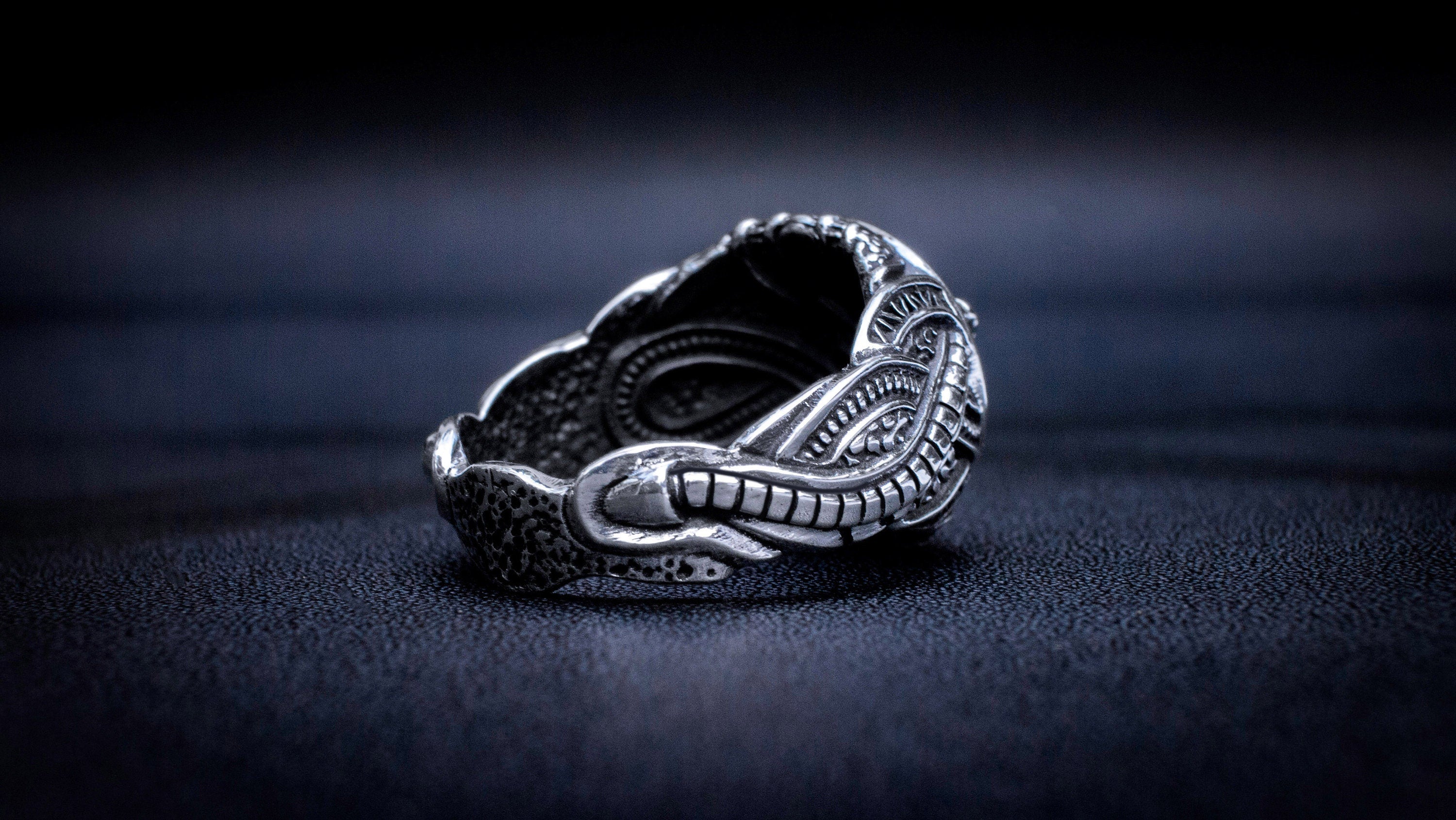 Silver Biomech Skull ring photographed from front angle