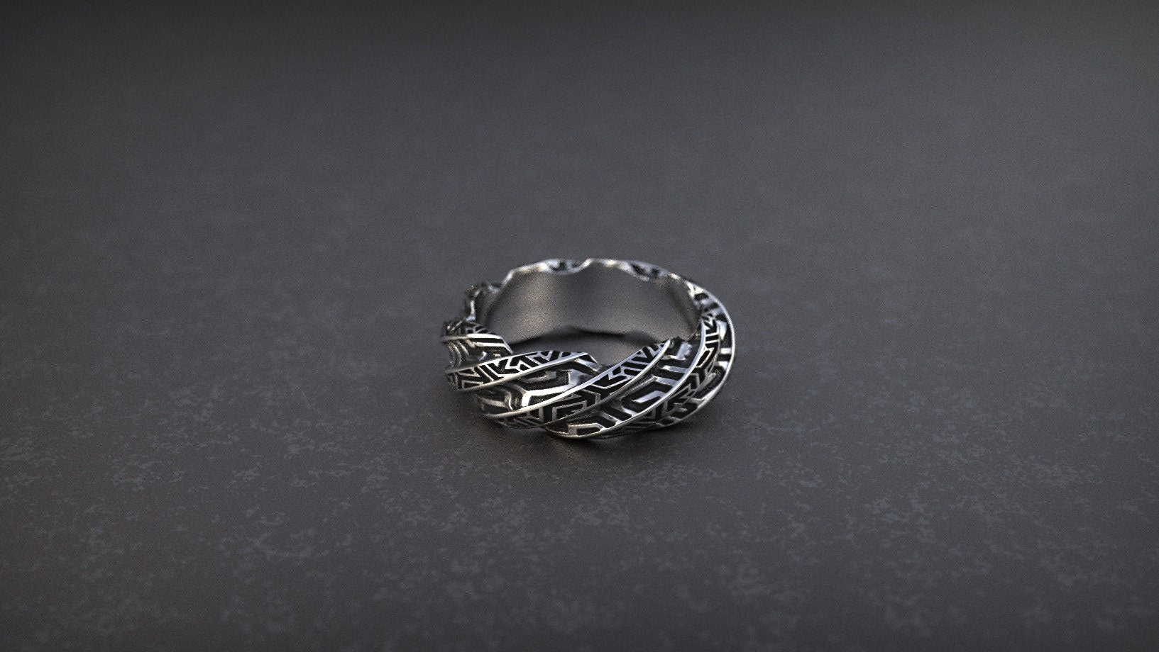 Silver cyberpunk-style ring displayed on dark background