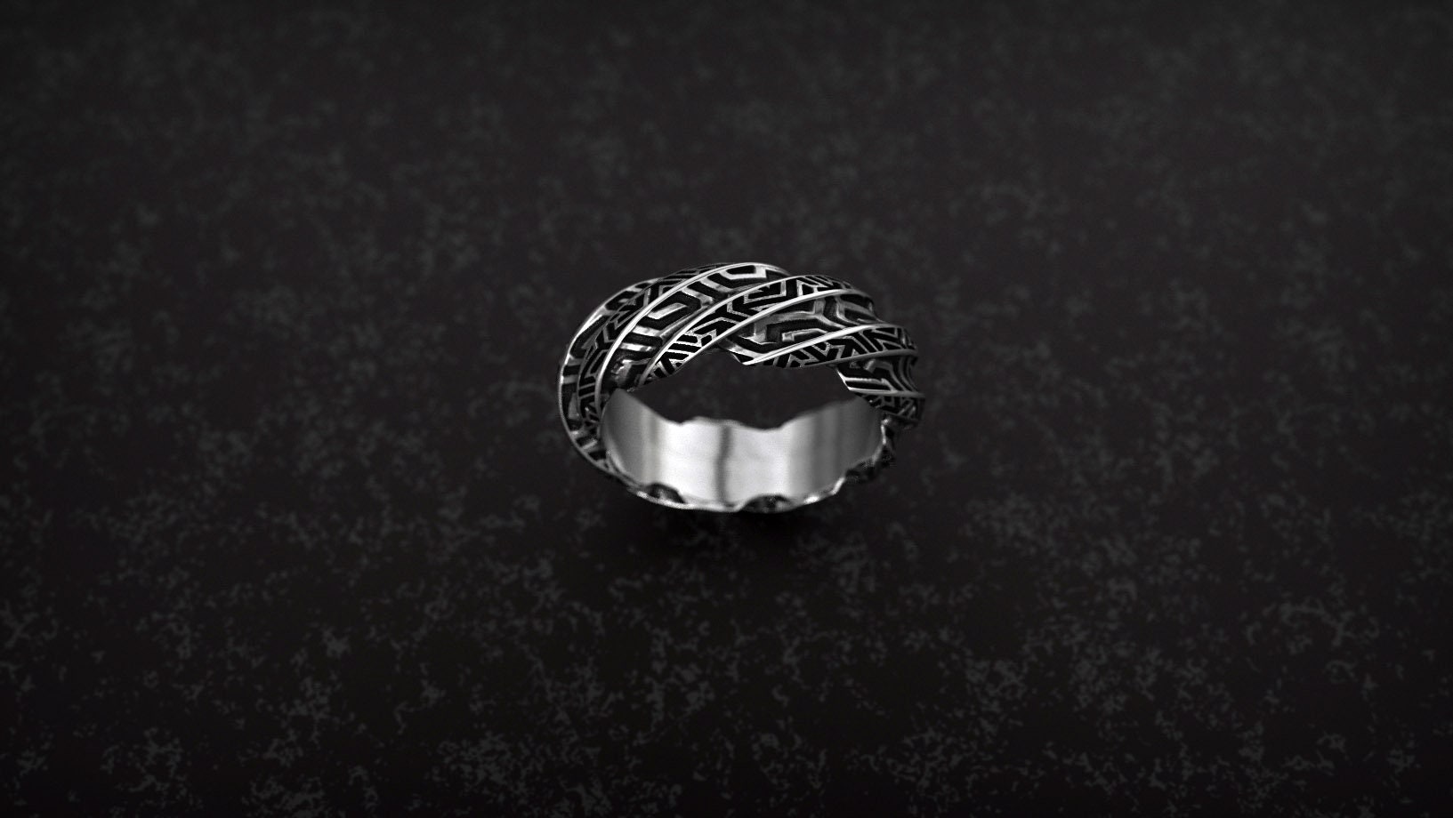 Geometric twisted ring photographed from front angle