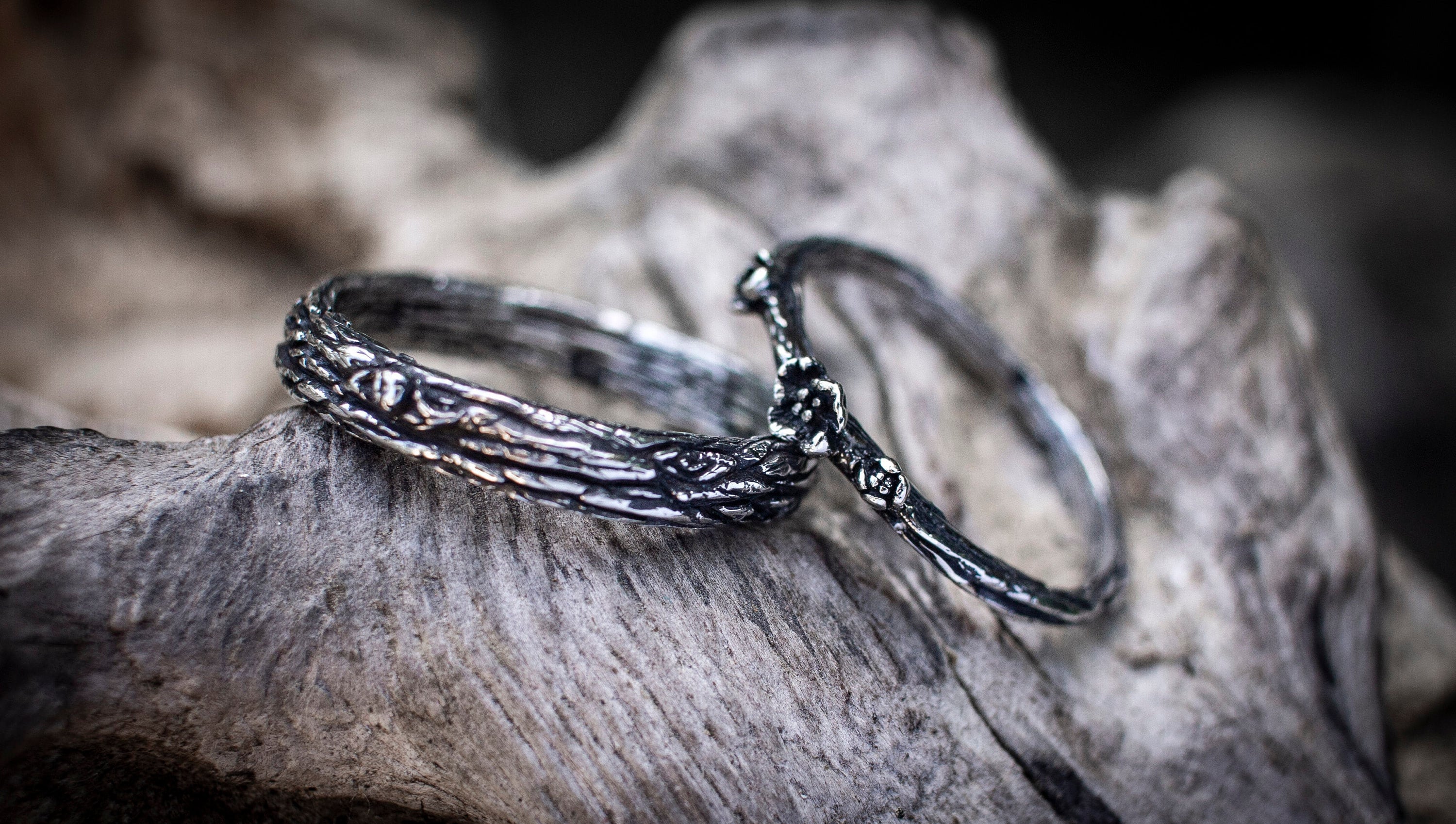 Nature-inspired silver couple rings photographed together