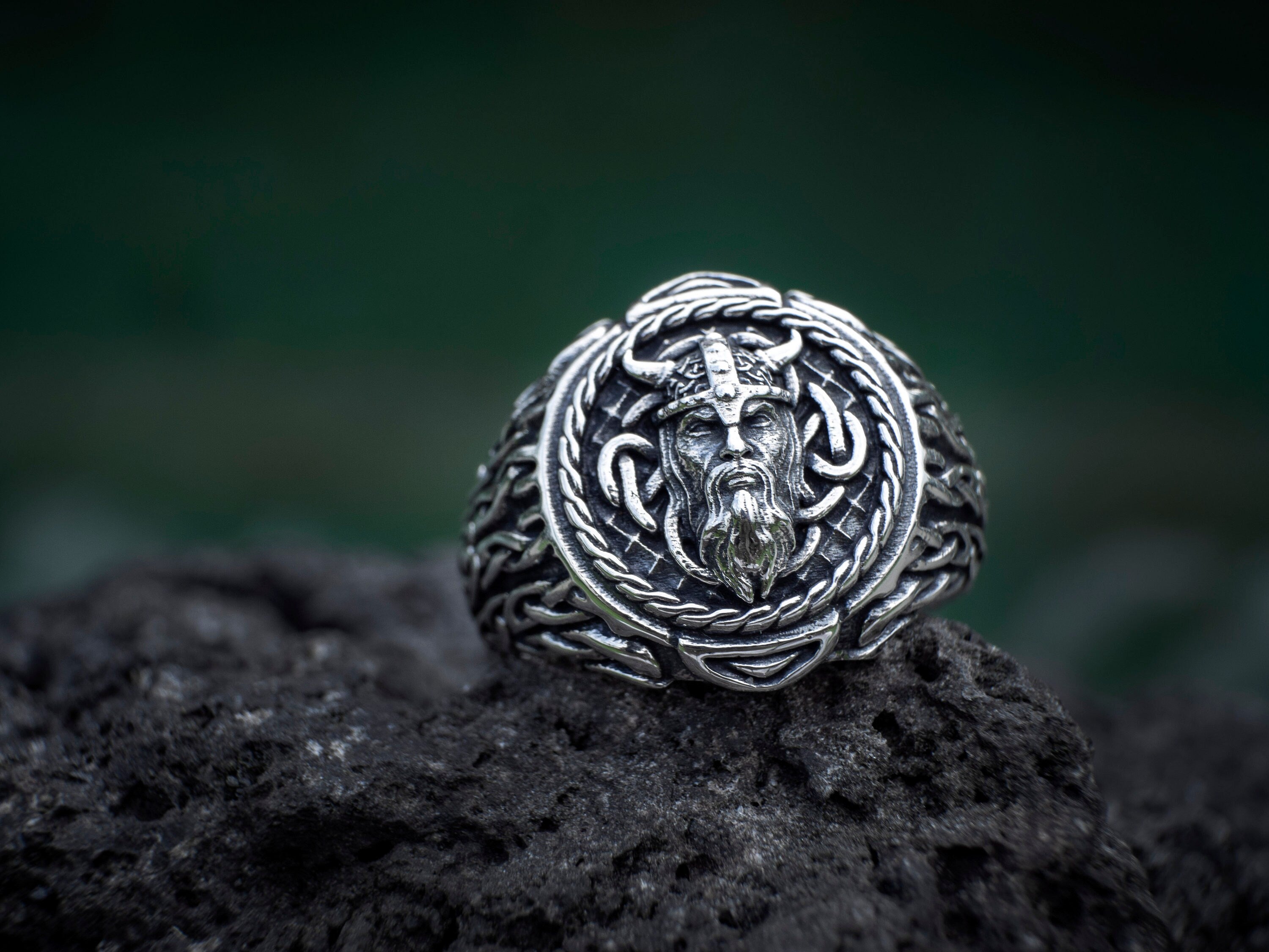 Odin silver ring displayed on dark background