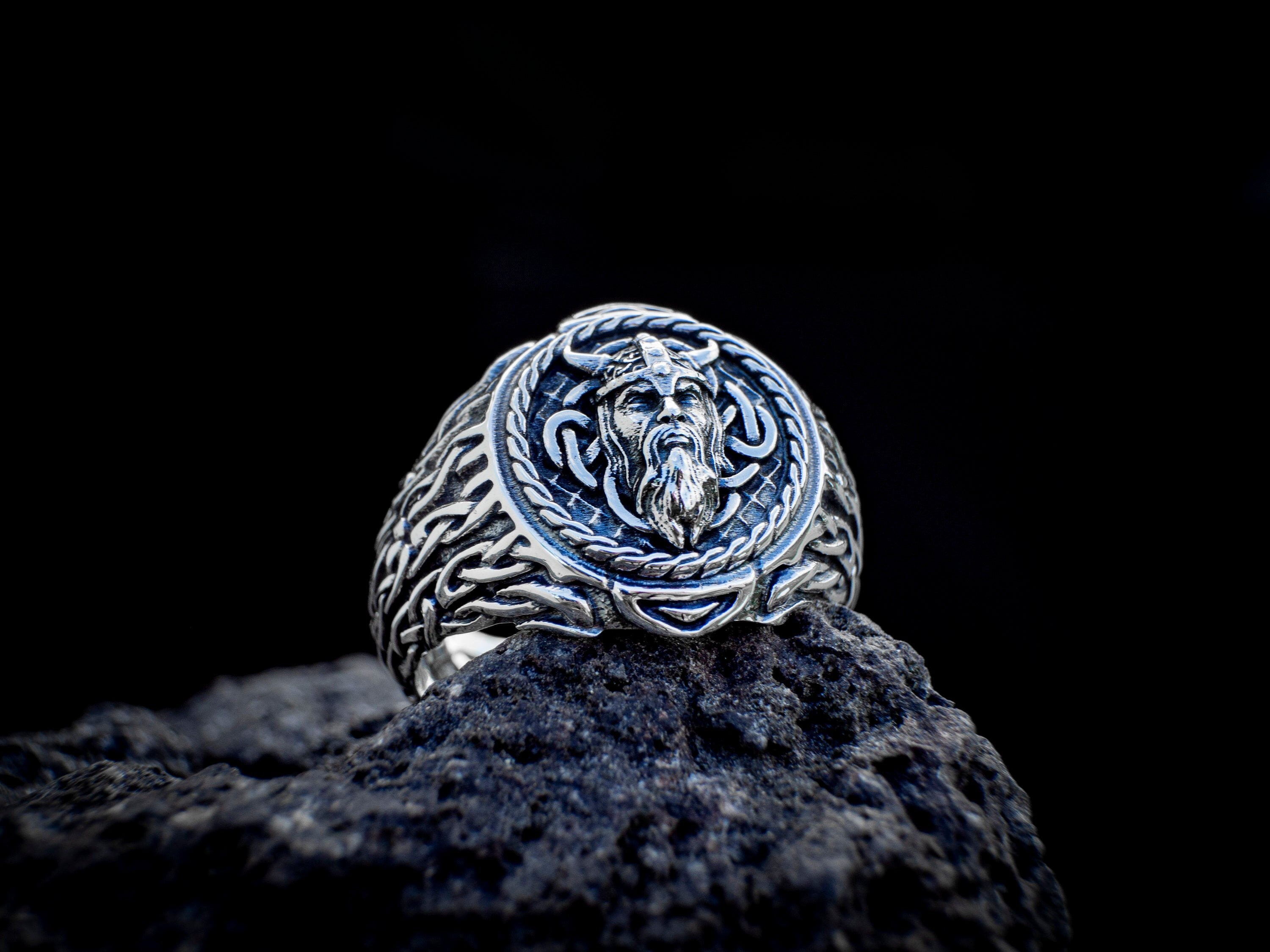 Close-up of Odin ring showing carved Norse face detail