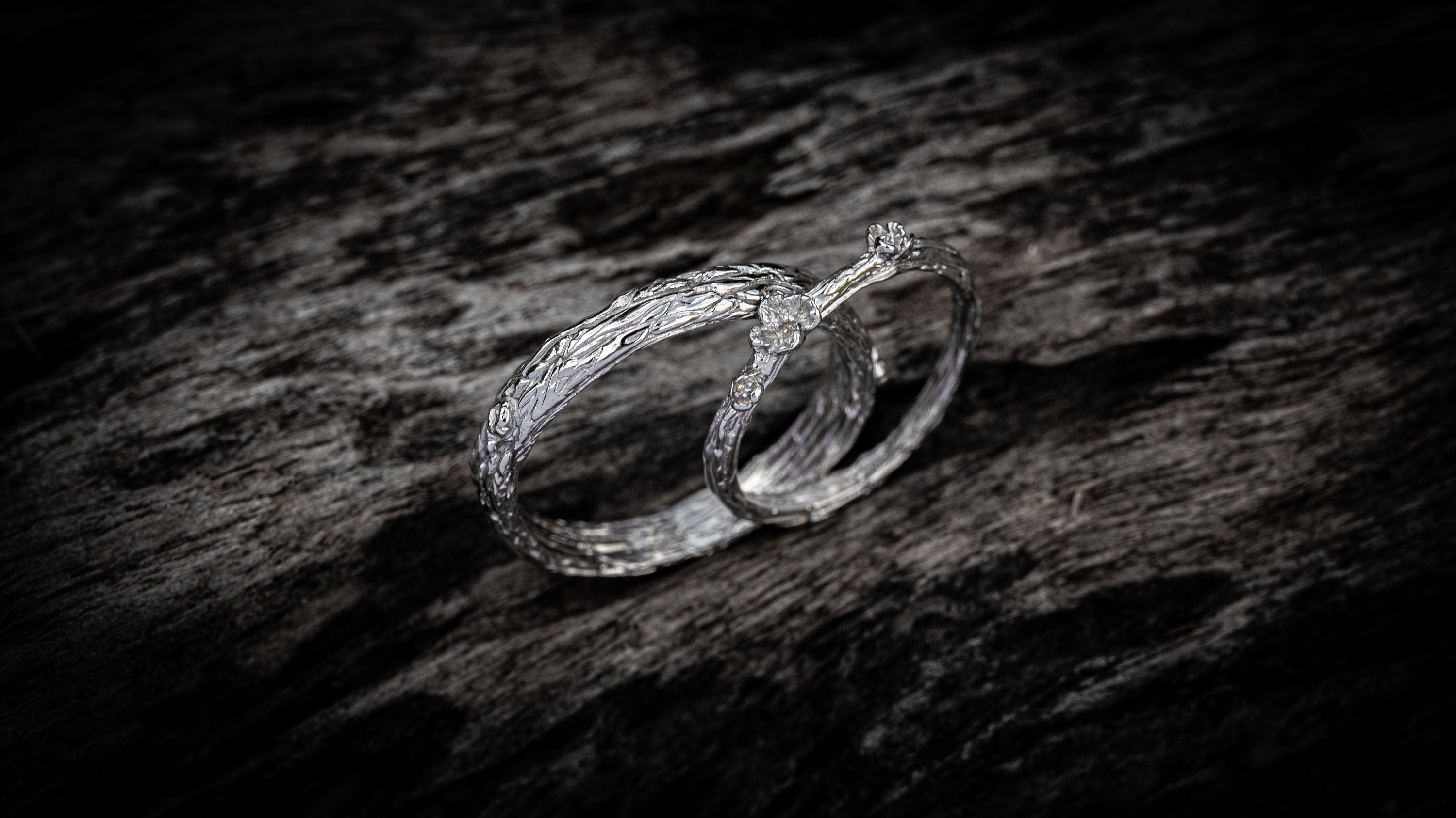Matching gold wedding bands inspired by forest bark texture