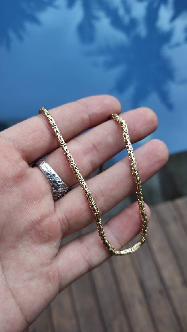 Vertical view of solid gold Byzantine chain with clasp