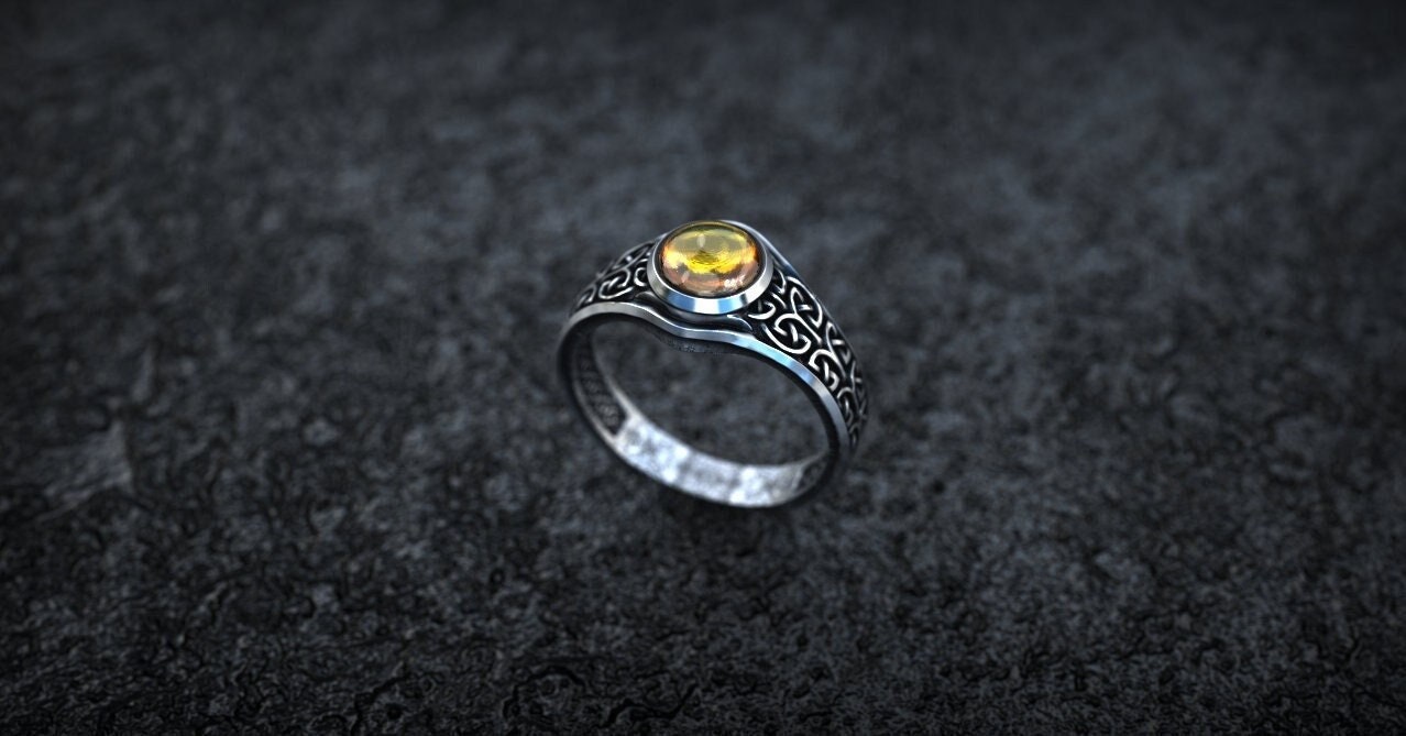 Viking-inspired silver ring photographed from front angle