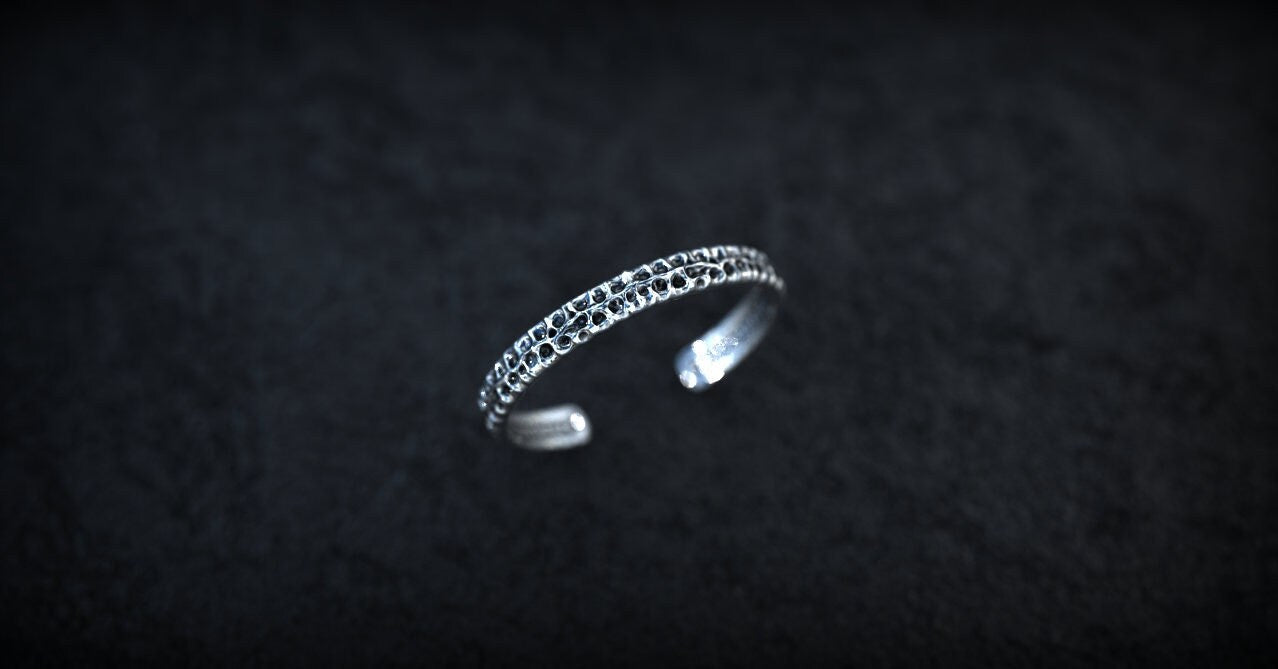 Heavy silver cuff bracelet shown from angled profile