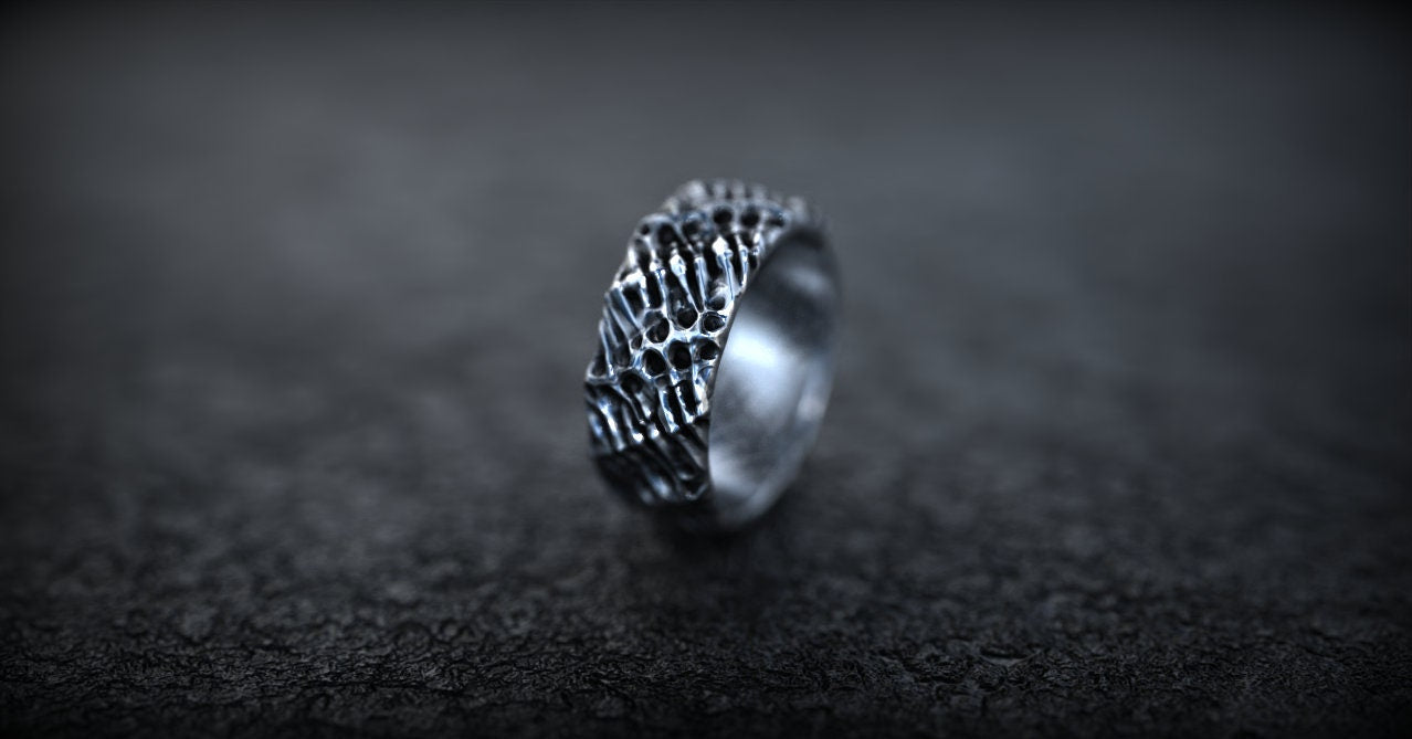 Handmade silver ring shown from angled profile
