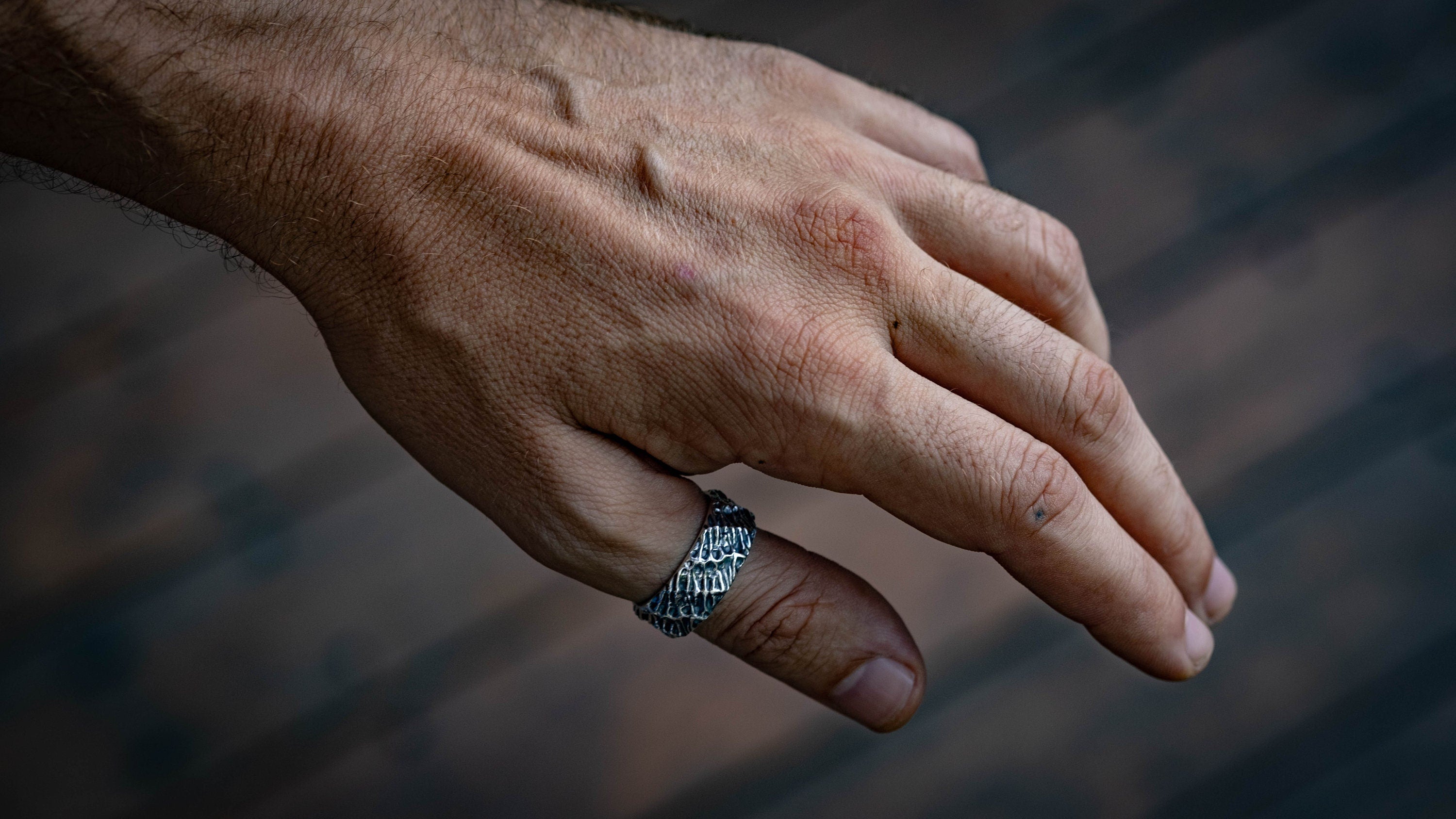 Alternative silver engagement ring with dark sculptural details