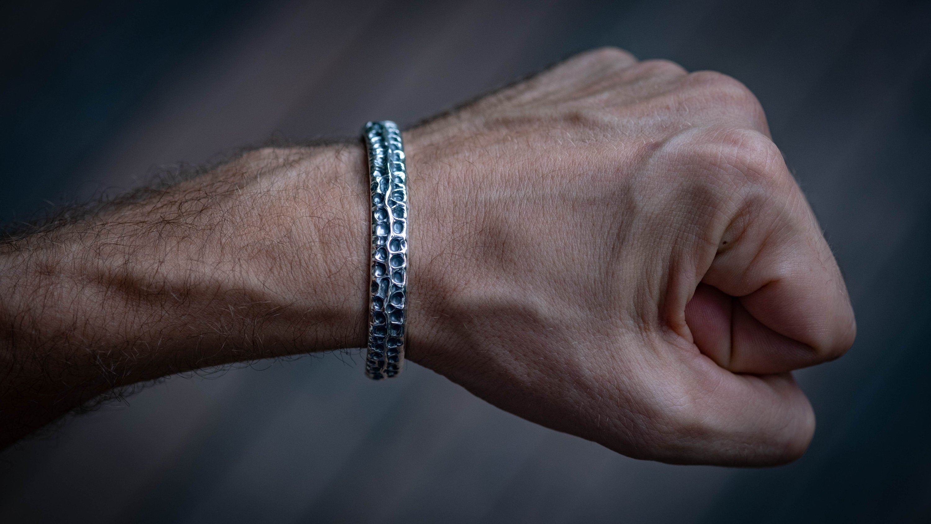 Side view of handmade sterling silver cuff bracelet