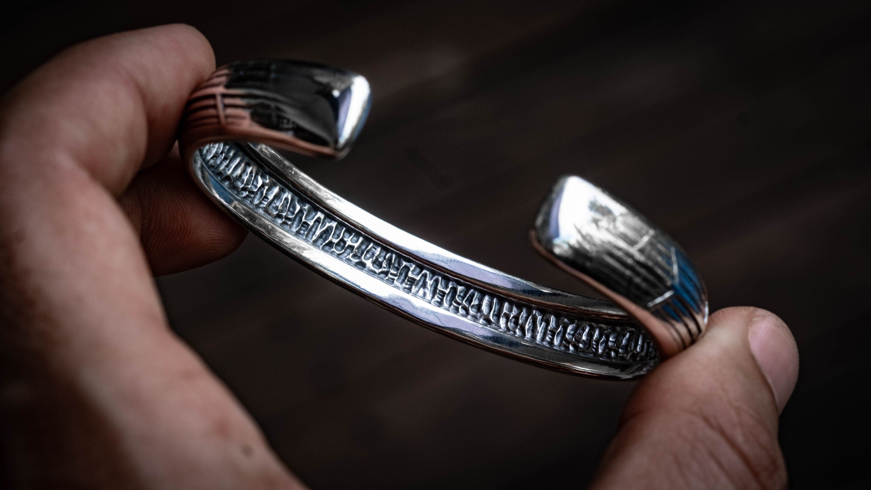 Side view of handmade heavy silver cuff bracelet