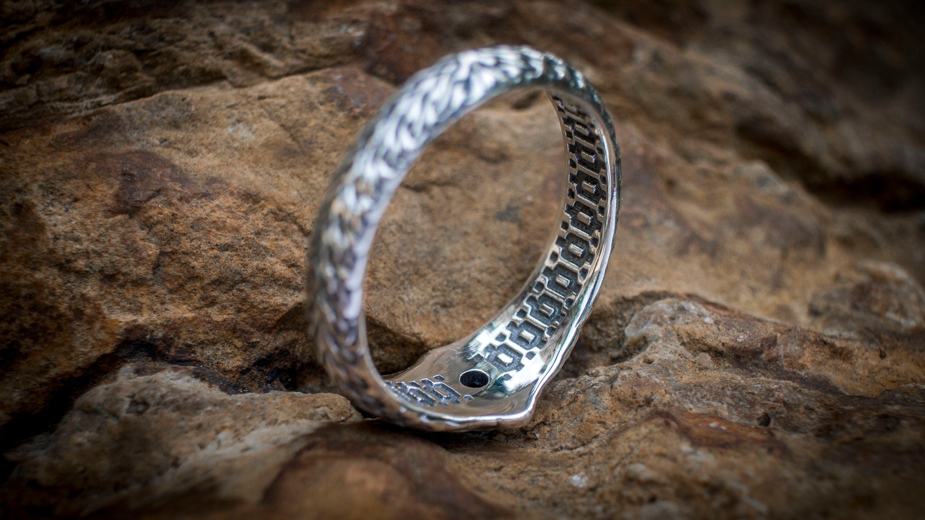 Sterling silver patterned ring shown from side profile