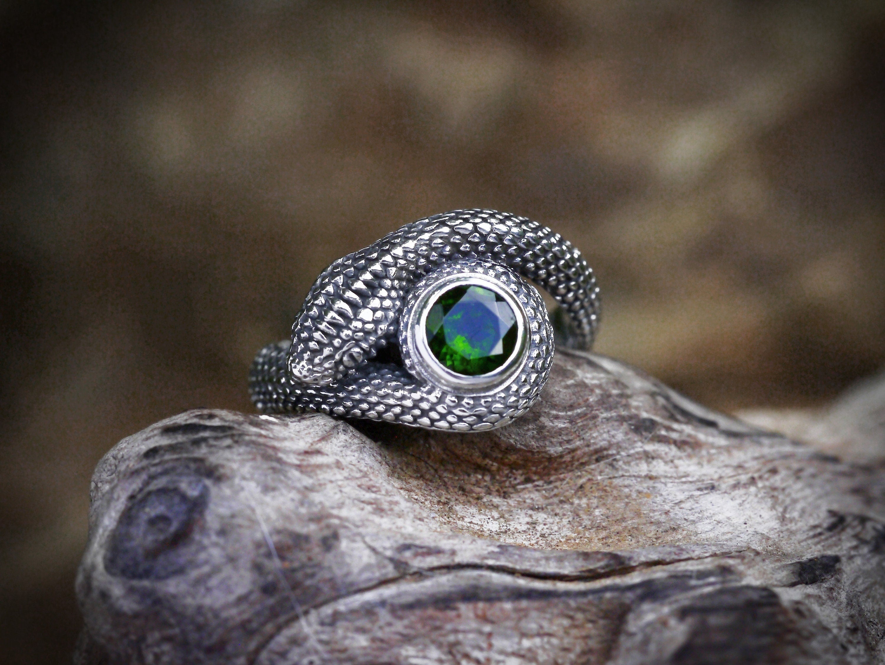 Serpent engagement ring shown from side angle
