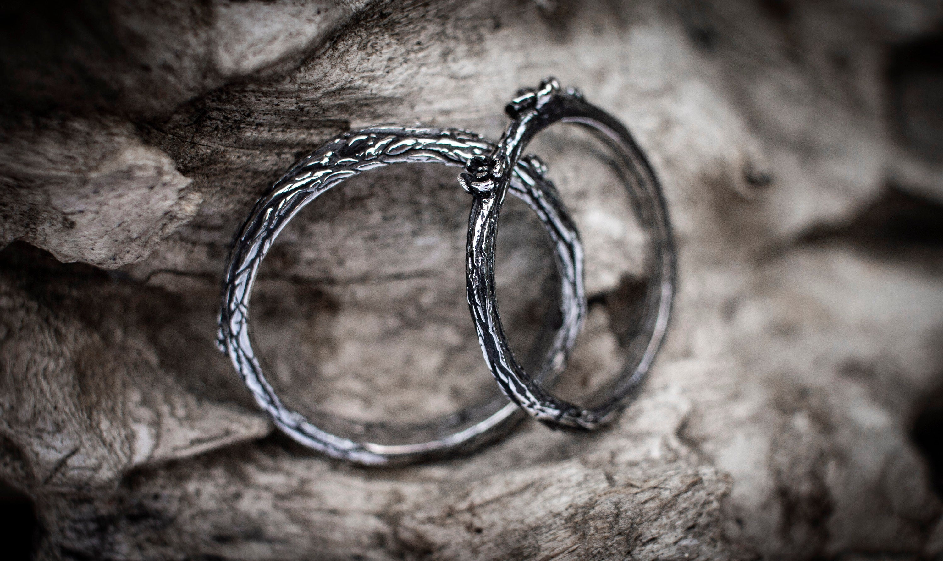 Handmade silver wedding bands with forest bark pattern