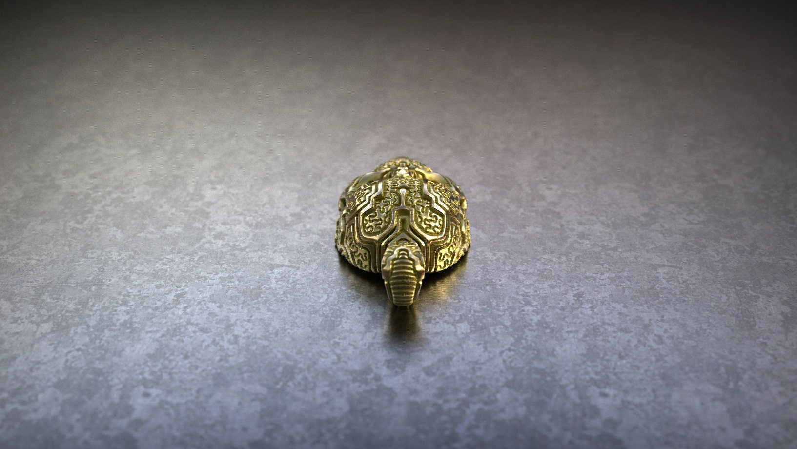 Gold carved skull pendant with symbolic texture
