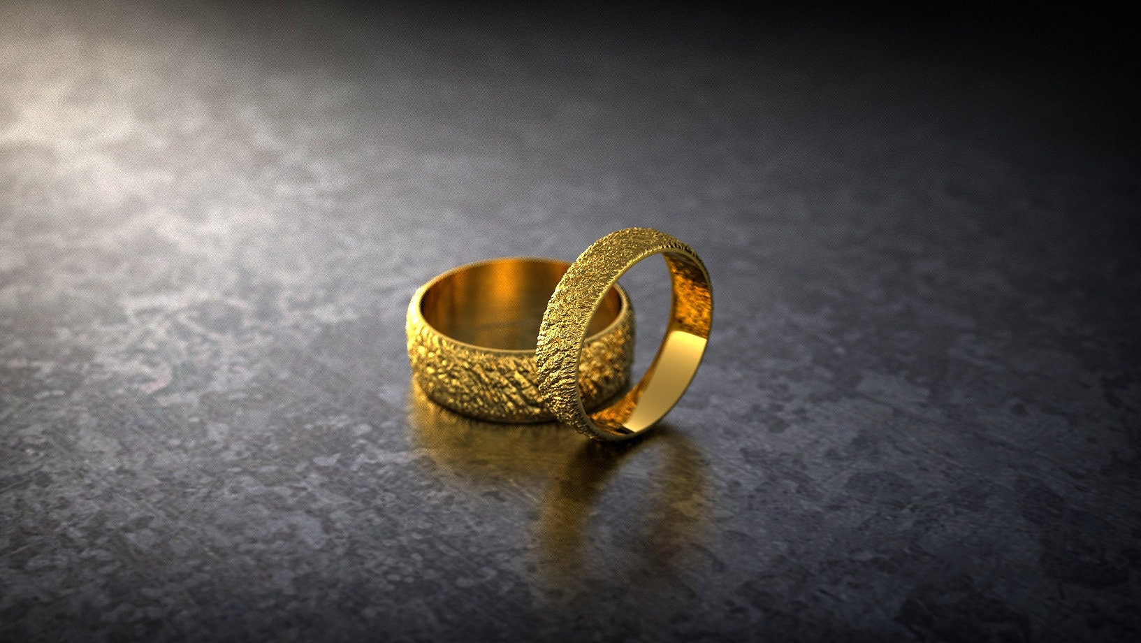 Handmade rustic gold rings displayed as unique wedding bands