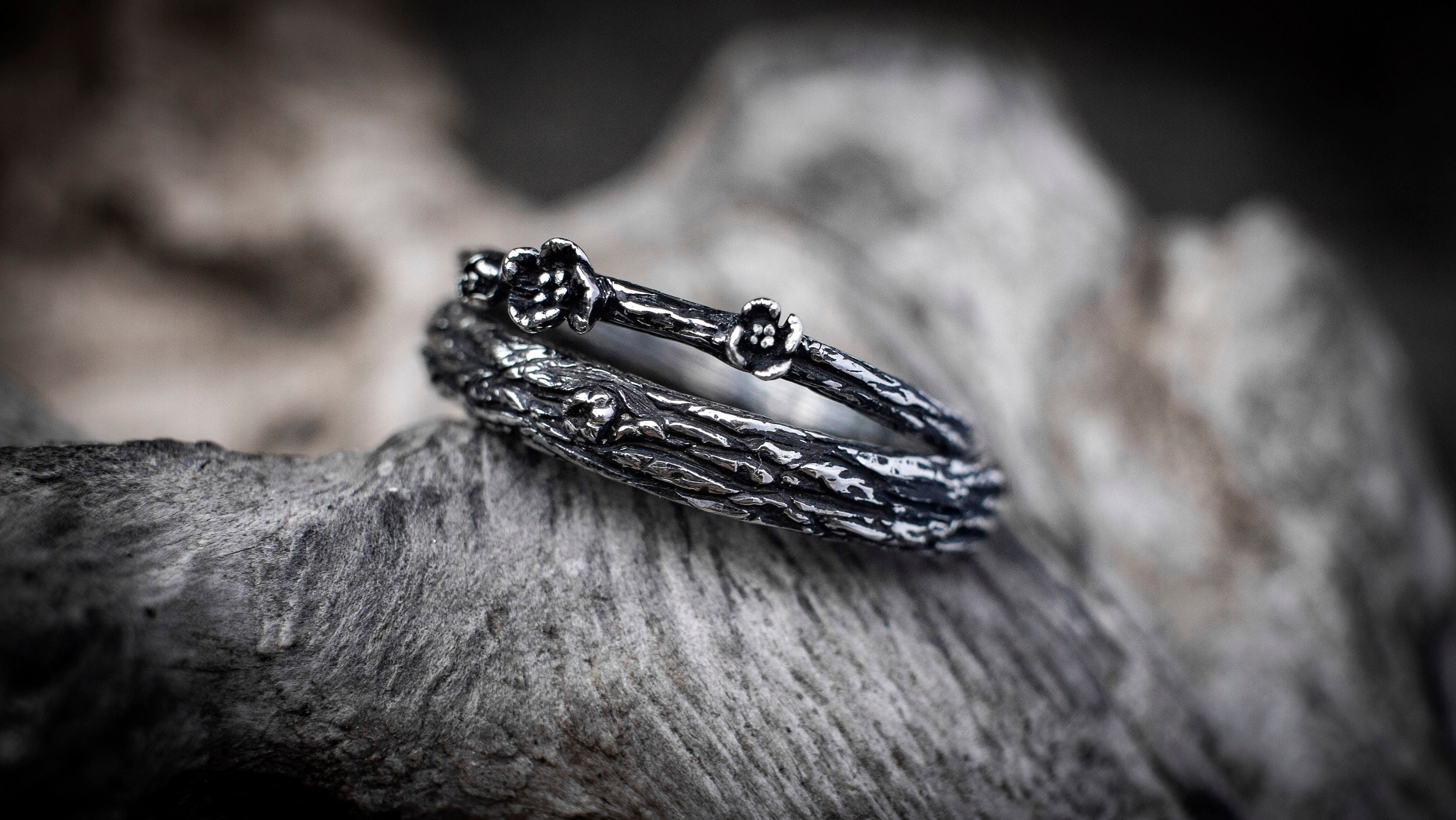 Side view of handmade silver tree bark wedding bands
