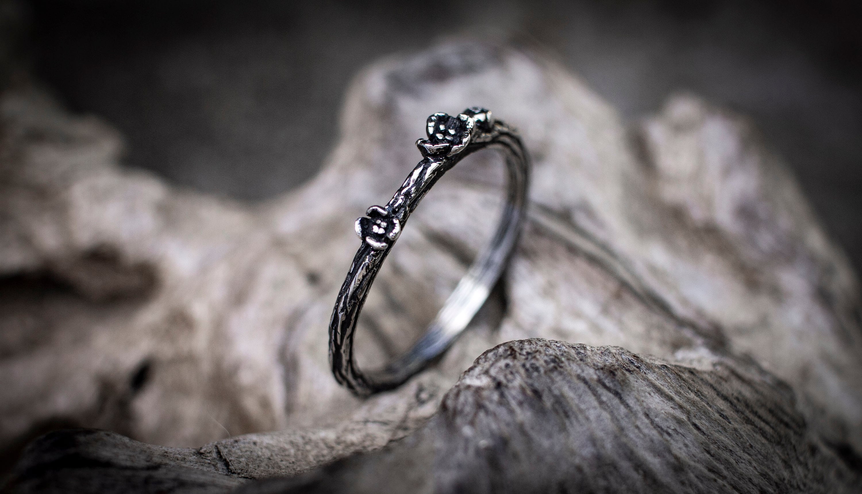 Silver tree bark wedding bands shown from alternate angle
