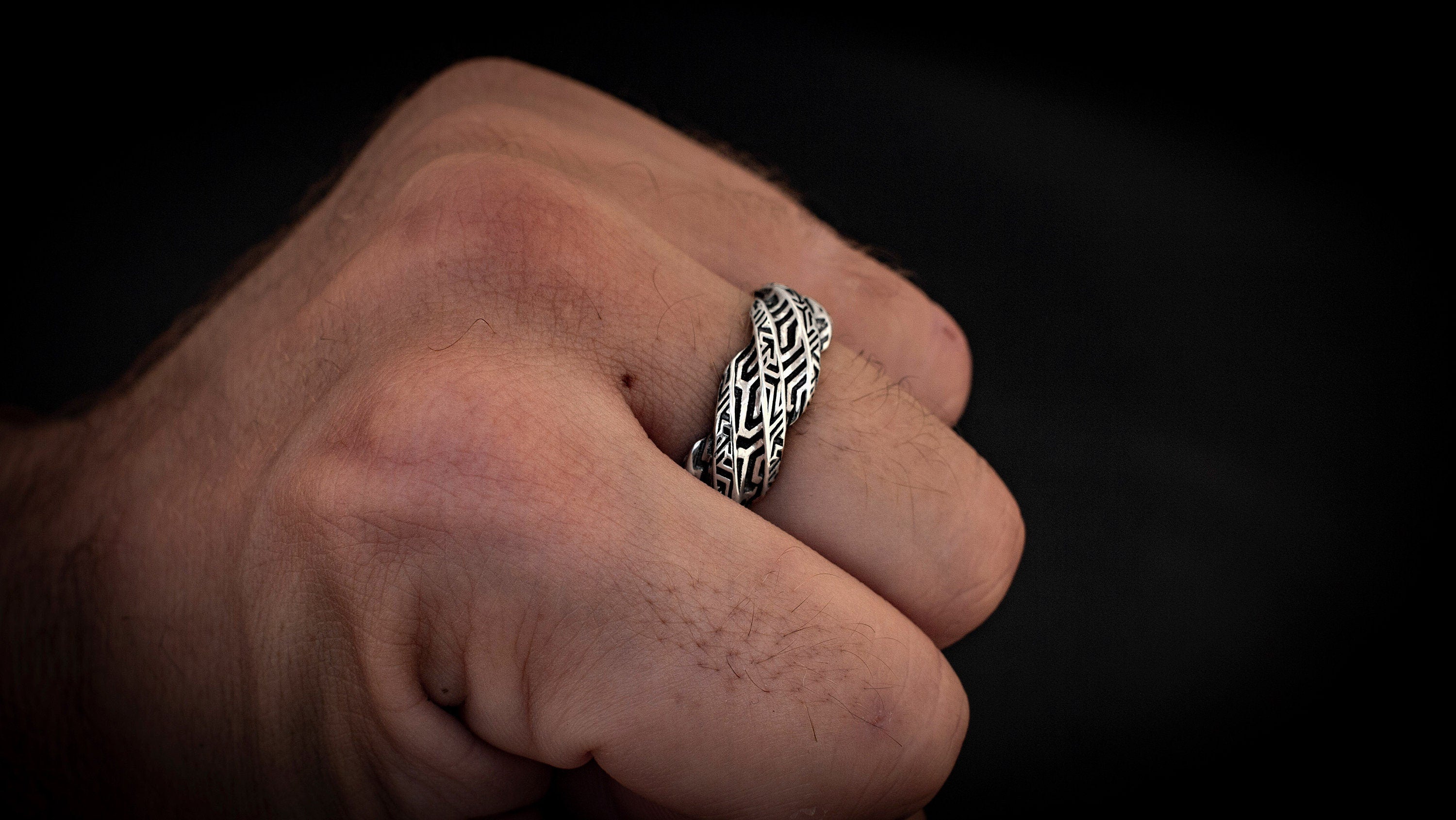 Futuristic silver ring with sculptural curved form