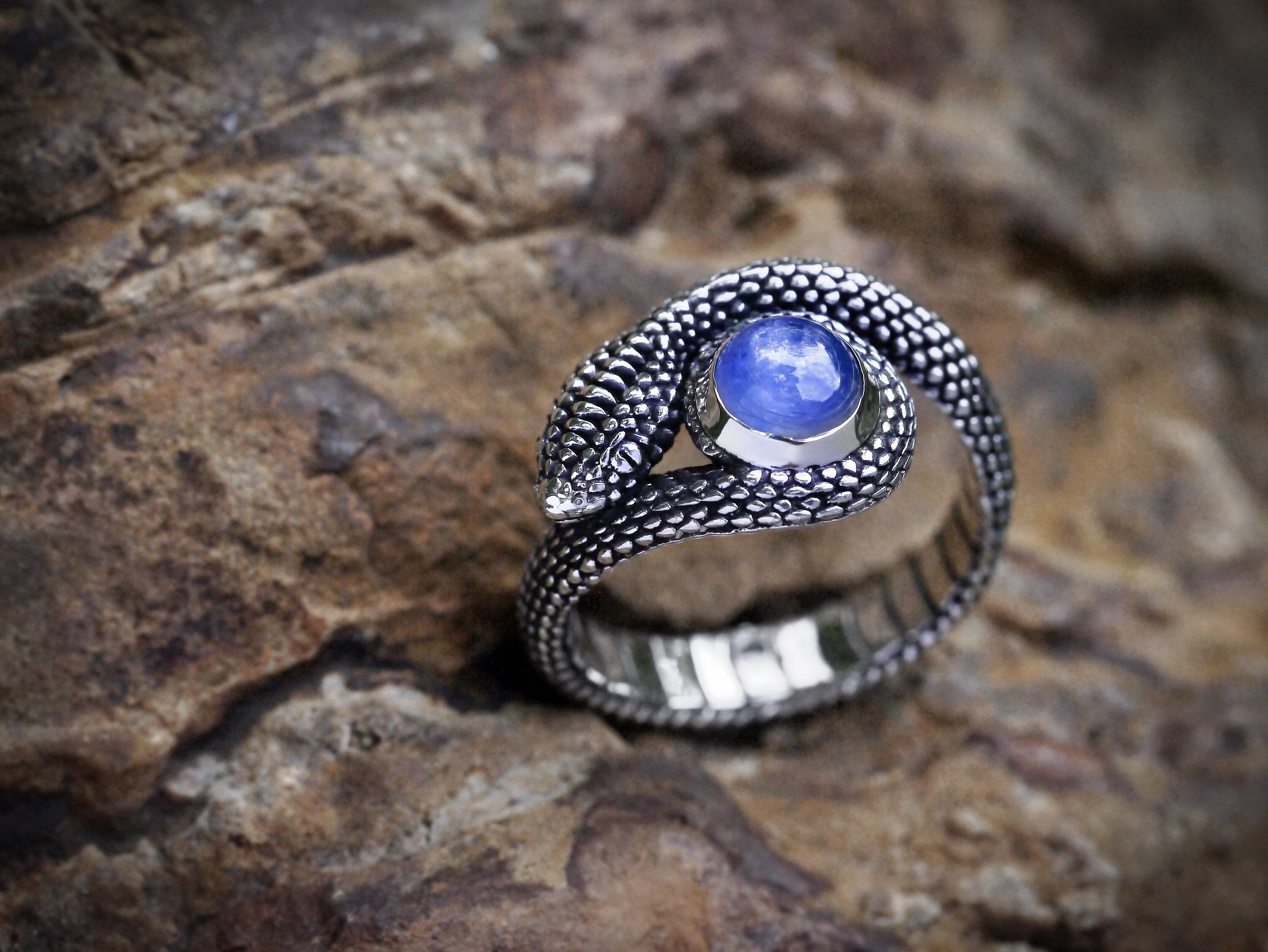 Amethyst snake jewelry displayed on dark background
