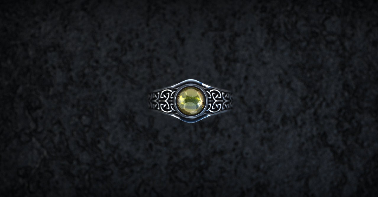 Handmade silver knotwork ring shown from angled profile