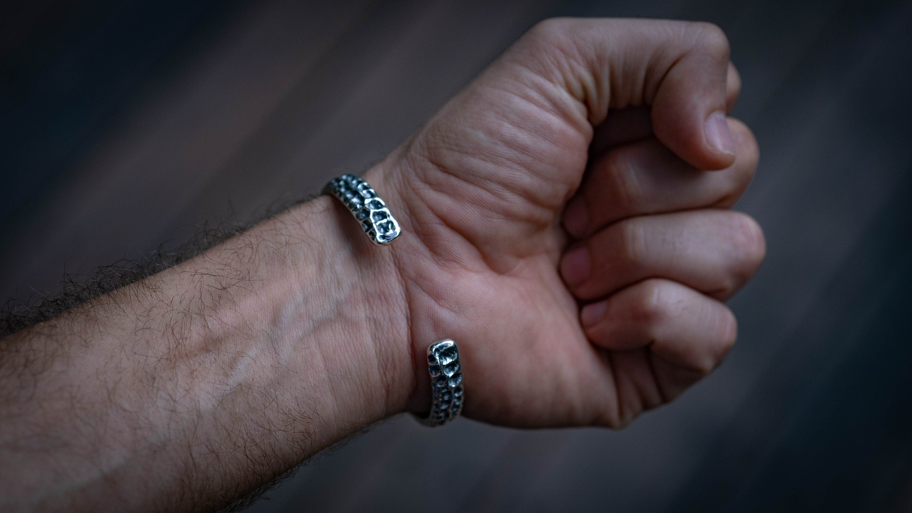 Textured silver bangle photographed from front angle