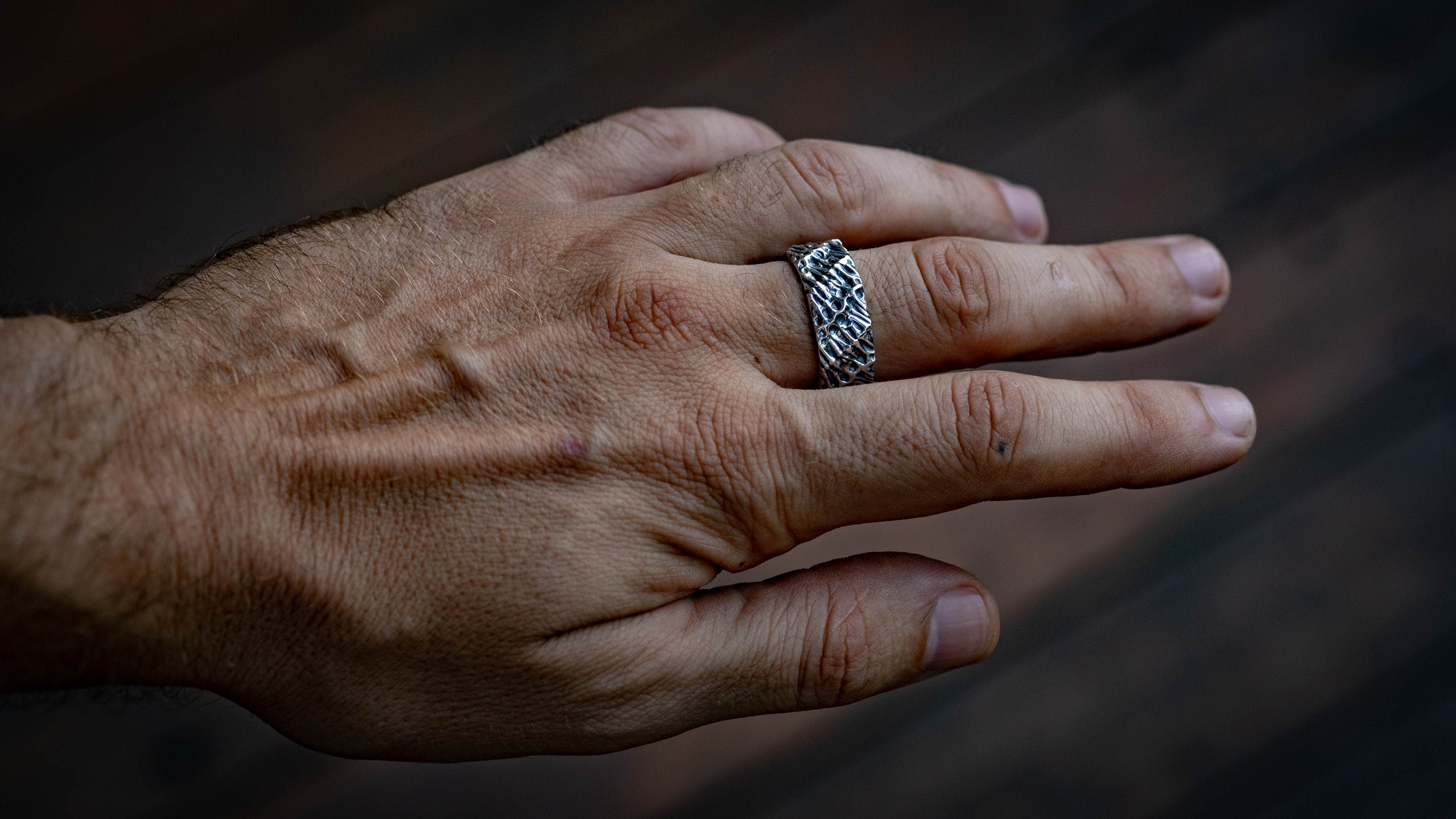 Vertical view of biomechanical silver engagement ring