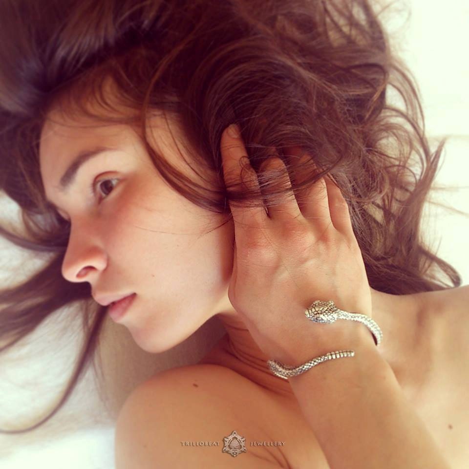 Sterling silver bangle shown from angled side profile