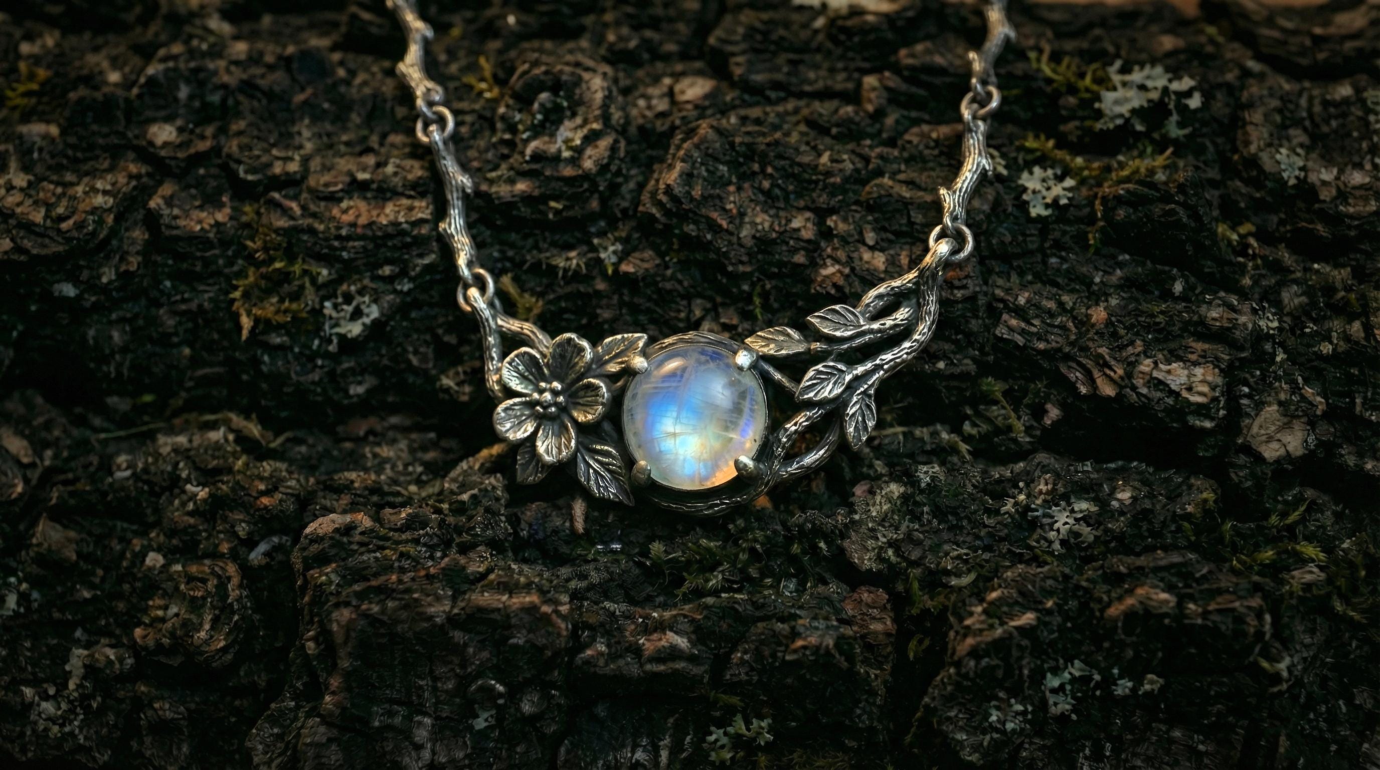 Silver branch moonstone necklace displayed from vertical view